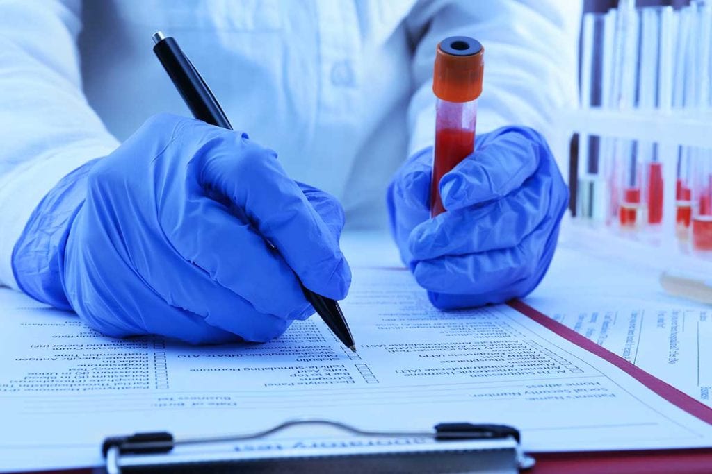 Laboratory worker with blood vile at Rocky Mountain Diabetes Center in Idaho Falls and Pocatello.
