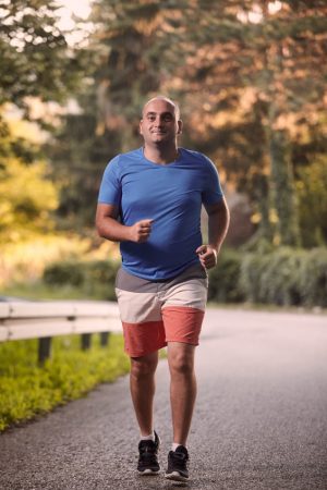 Man jogging in spite of his Low T, also referred to as Low Testosterone and needing an endocrinologist specialist doctor in Idaho Falls or Pocatello.
